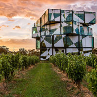 Sun setting over the vineyards and d’Arenberg Cube in McLaren Vale